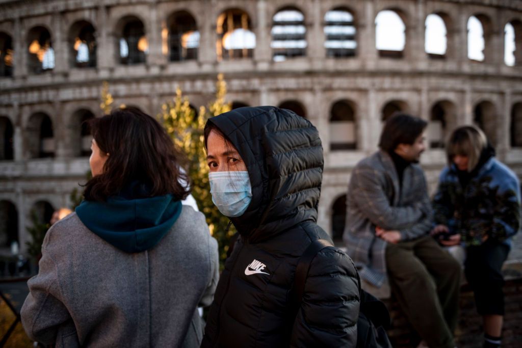 ROME, ITALY - FEBRUARY 6: Chinese tourists wearing face masks visit the Colosseum area on February 6, 2020 in Rome, Italy. The Italian government declared a state of emergency on January 31 after two cases of coronavirus in Rome and today an initial test on one of the 56 Italians airlifted back from the Chinese city of Wuhan and currently in observation at the Cecchignola military facility has indicated he may have the coronavirus. (Photo by Antonio Masiello/Getty Images)